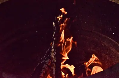 a campfire burning down to embers